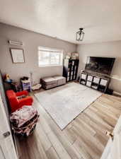 Basement Family room featuring wood finished floors