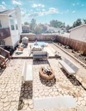 View of deck patio / terrace featuring an outdoor fire pit and a fenced backyard