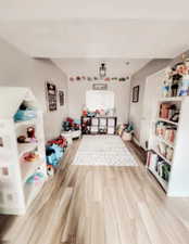 Game room with wood finished floors