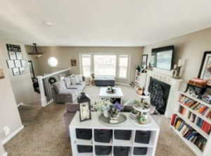Living area with baseboards, carpet floors, and a fireplace