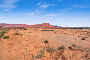 Property view of mountains featuring a rural view and view of desert