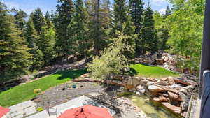 View of green lawn featuring a patio area