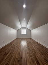 Additional living space featuring a textured ceiling and baseboards