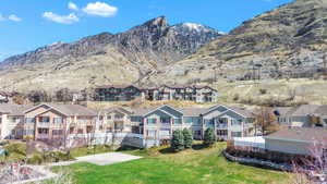 Property view of mountains with a residential view