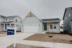 View of front facade featuring a two-car garage