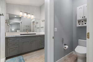 Bathroom #1 - Newly remodeled on-suite 3/4 bath with granite vanity, laminate floors and over-sized luxurious shower to the left of vanity