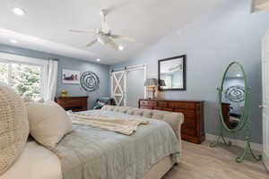 Bedroom #2: Large primary bedroom featuring luxurious on-suite with barn doors. Corner windows overlook the backyard