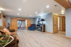 Family room with French doors leading to recreation room. Bathroom #4 is to the right