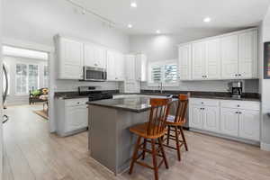 View of kitchen looking into dining area. The kitchen could easily be remodeled to create an open concept kitchen/dining area