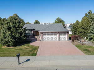 Straight-on view of driveway and front entrance to home