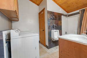 Bathroom #6 - Full bath with toilet and urinal combined with washer/dryer