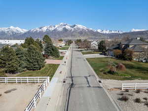 View of mountains to the east off of main road. House is set back off of the street behind the trees for extra privacy