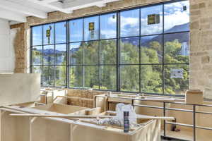 Lobby with a mountain view and a wood ceiling with exposed beams