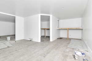 Additional living space featuring baseboards