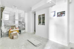 Interior space with concrete flooring and baseboards