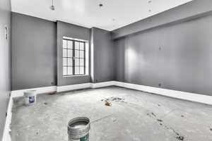 Spare room featuring baseboards