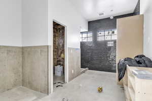Bathroom featuring tile walls and tile patterned floors