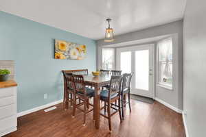 Large dining room with doors going to backyard