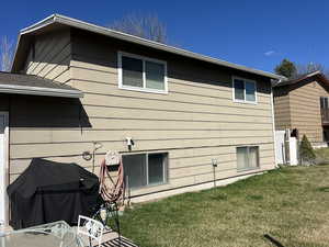 View of property exterior featuring a yard