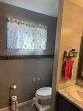 Half bath with toilet and vanity