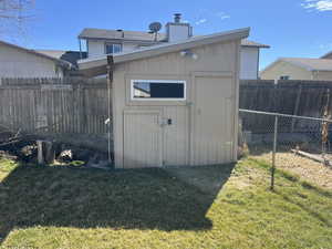 View of shed featuring a fenced backyard