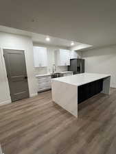 Kitchen with white cabinets, quartz countertops