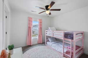 2nd Bedroom with carpet floors, baseboards, ceiling fan, and visible vents
