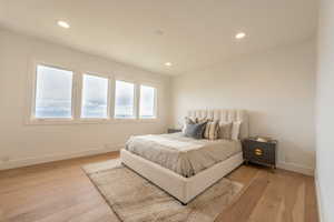 Bedroom 2 main floor with west city and sunset views