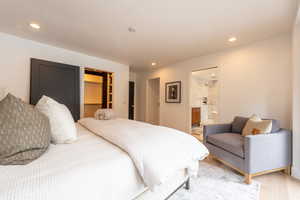 Primary suite view 2 with walk in closet, w/d and large en suite 5 piece bathroom oasis.