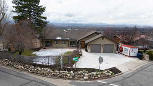 Single story home featuring fence, a shingled roof, concrete driveway, stucco siding, and a garage