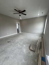 Unfurnished room with baseboards, visible vents, and a ceiling fan