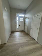 Foyer with light wood-style flooring