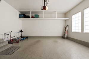 Garage featuring a garage door opener