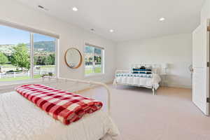 Bedroom with baseboards, visible vents, and recessed lighting