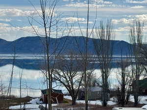 Property view of lake and mountains