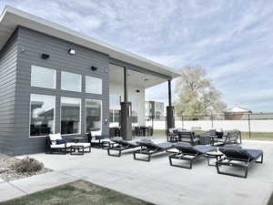 View of patio with outdoor lounge area and fence