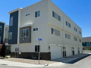 View of building exterior featuring an attached garage