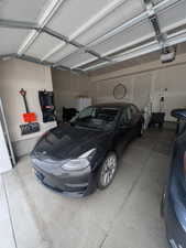 Garage featuring a garage door opener