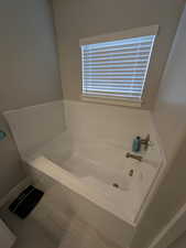 Full bath featuring a garden tub