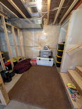 Unfinished basement with stairway