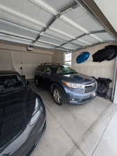 Garage featuring a garage door opener and a commercial grade NEMA 1450 outlet