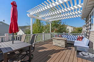 Deck featuring a pergola, an outdoor living space, and outdoor dining space