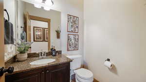 Bathroom featuring toilet and vanity