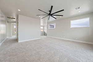 Unfurnished room featuring recessed lighting, a textured ceiling, and visible vents