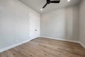 Unfurnished room with baseboards, light wood-style flooring, recessed lighting, and a ceiling fan