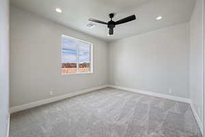 Carpeted empty room with recessed lighting, baseboards, a textured ceiling, visible vents, and ceiling fan