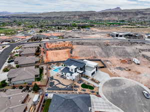 Birds eye view of property with a mountain view and a residential view