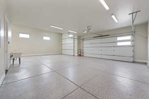 Garage featuring baseboards