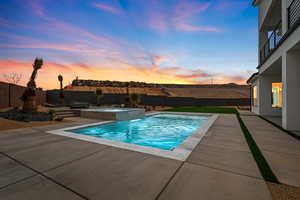 View of swimming pool with a fenced backyard, a fenced in pool, and a patio