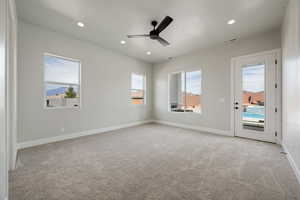 Empty room with a ceiling fan, light carpet, baseboards, visible vents, and recessed lighting